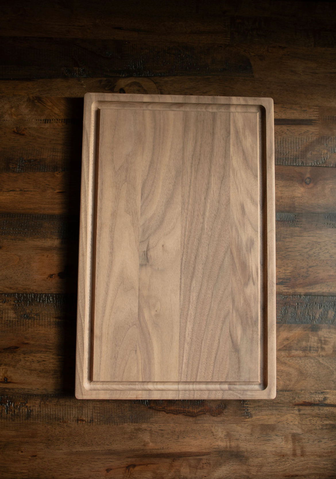 NEW!! Walnut (Un-Oiled). Once oiled, the cutting board will display a dark walnut color.